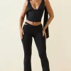 Oh Polly Bottoms^Petite Cut-Out Mid-Rise Flared Trousers in Black