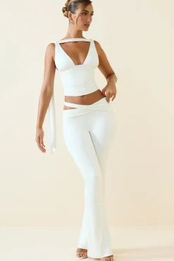 Oh Polly Bottoms^Petite Cut-Out Mid-Rise Flared Trousers in Vanilla