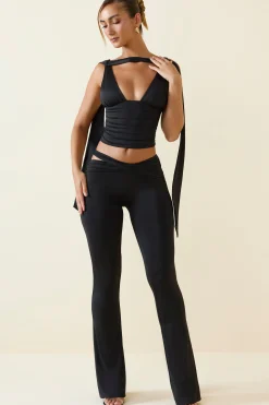 Oh Polly Bottoms^Petite Cut-Out Mid-Rise Flared Trousers in Black