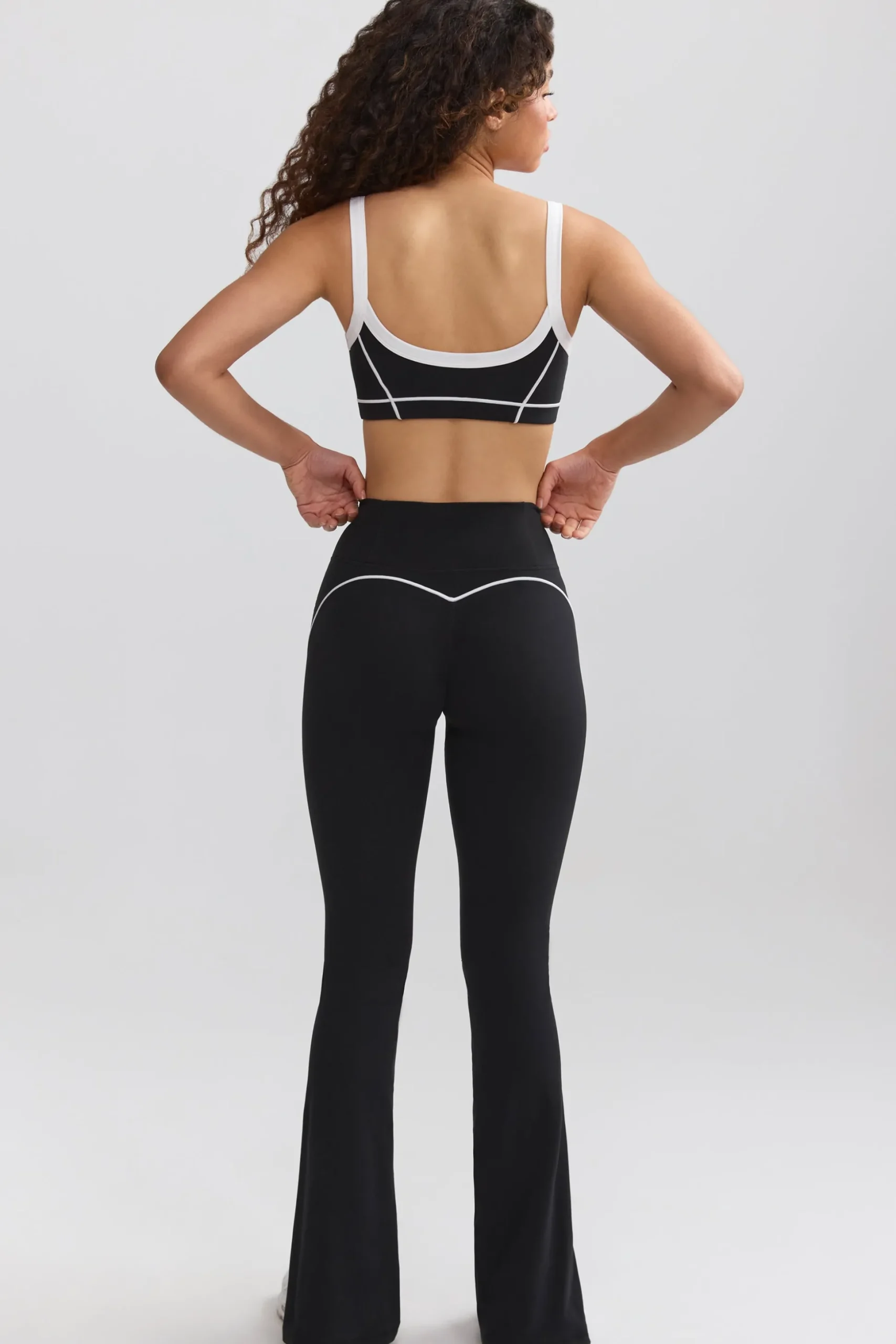 Oh Polly Petite^Petite Soft Active Contrast-Trim Flared Trousers in Black
